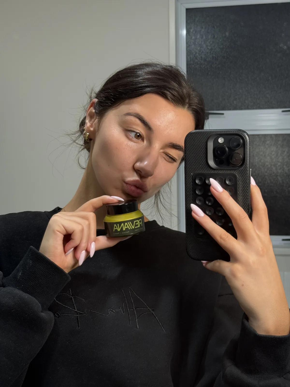 Reviana Night Cream applied at the mirror