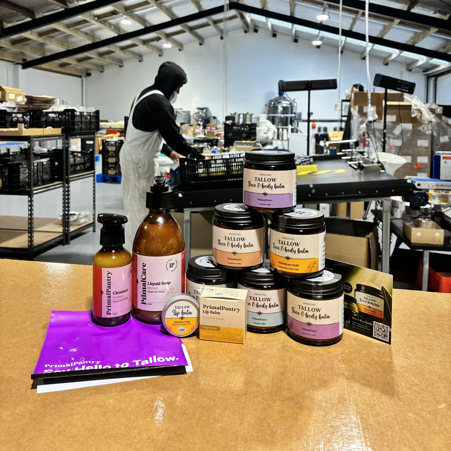 The routine laid out on the packing bench in our Christchurch workshop: balm jars with the cleanser, liquid soap, lip balm and the welcome card